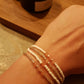 Armbandje Witte glaskraal met roze